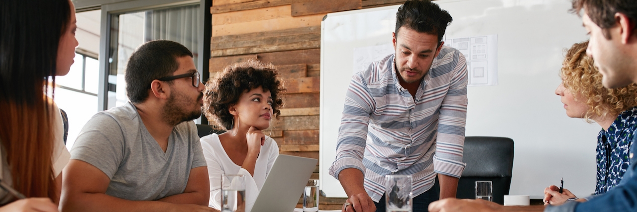 Dealing With a Chronic Illness While Working: What I've Learned Business team in a meeting