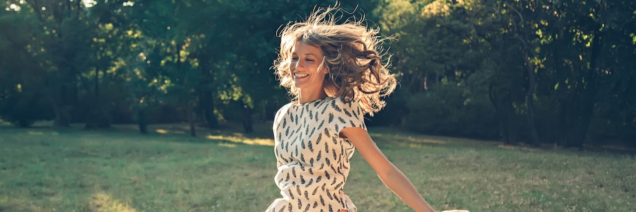 'Highly-Sensitive Person': Ways to Take Care of Your Mental Health Happy girl jumping in a park