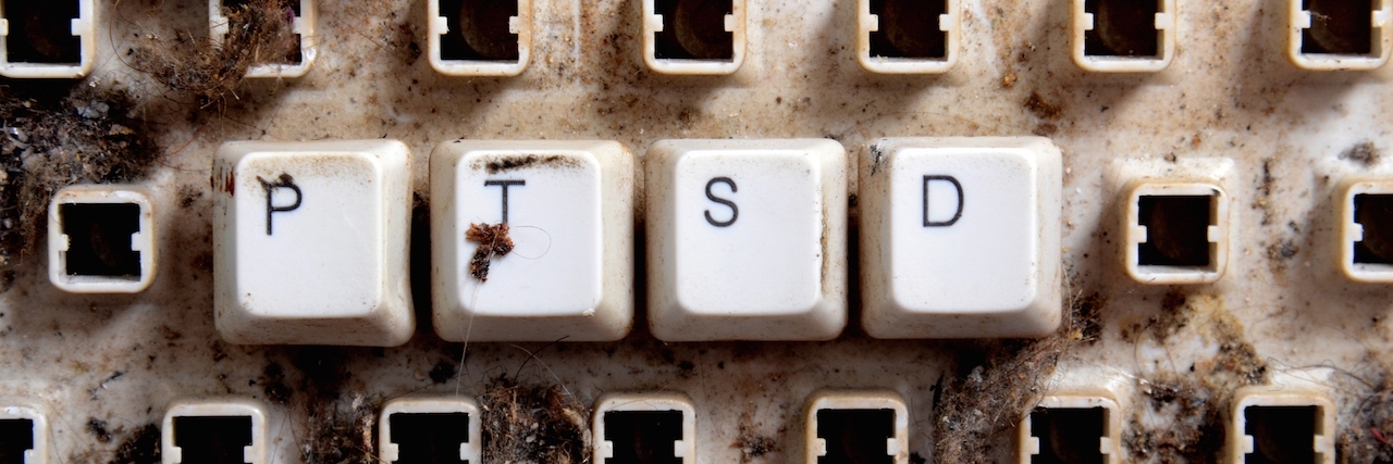 PTSD word with an old dirty keyboard.