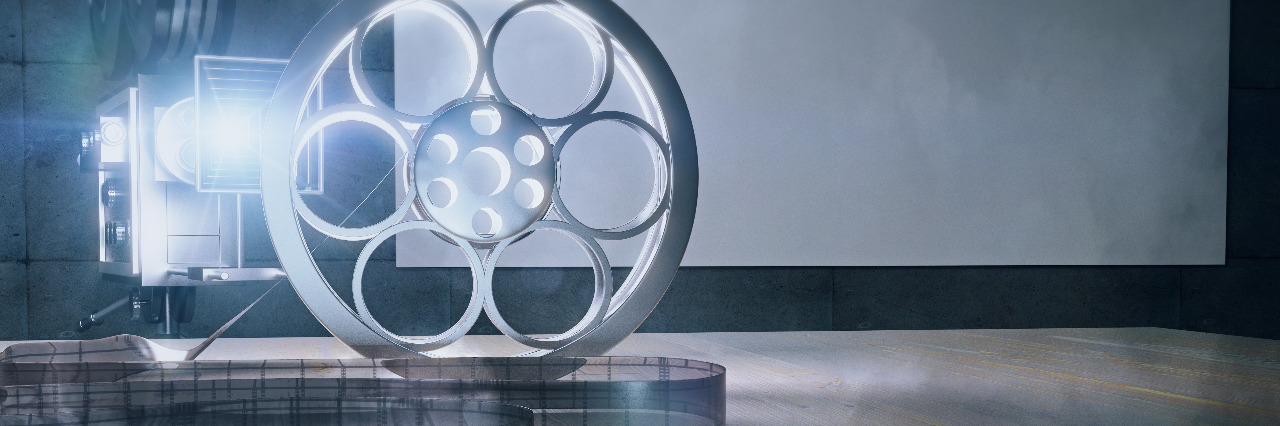 What I Wish the Entertainment Industry Understood About Autism Movie camera and film on wooden table.