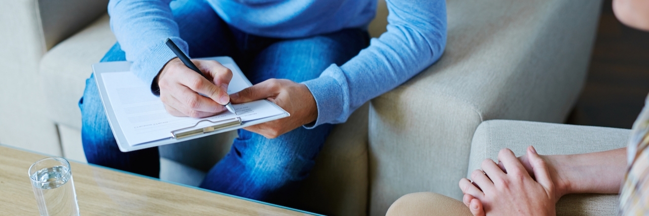 Goals of Therapy for Your Mental Health Male psychologist making notes during psychological therapy