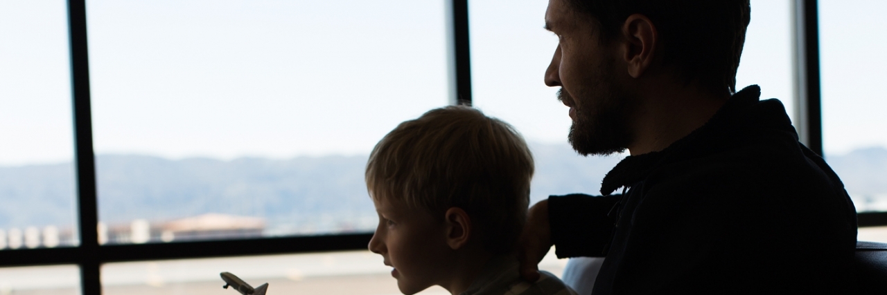 Dad Thanks 'Cool Guy' on Plane Who Saw His Son With Autism Melt Down silhouettes of family in airport ready for departure