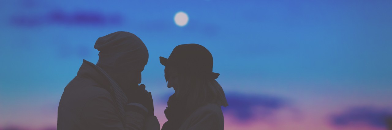 Telling the Person You're Dating About Your Mental Illnesses Silhouette of couple in front of evening sky