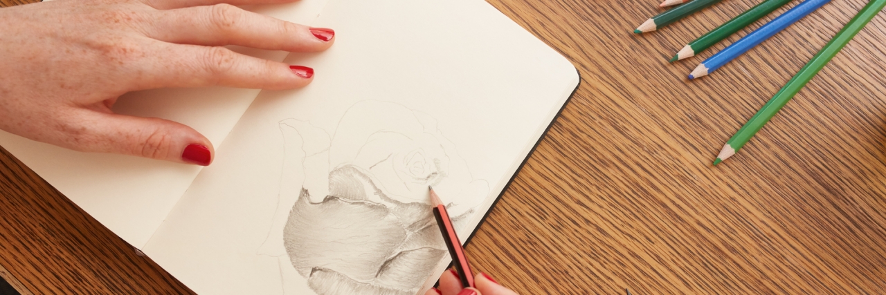 When I Drew Pictures to Understand My Depression Woman sketching a flower in sketchbook