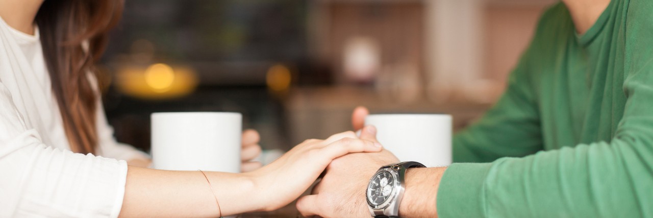 To the Man Who Gave Me Courage Through My Mental Illness Cute couple holding hands in a restaurant