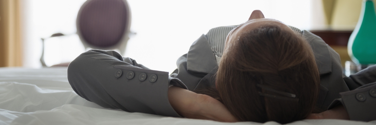 Hardest Parts of Having Fibromyalgia for People to Understand woman lying on back on bed