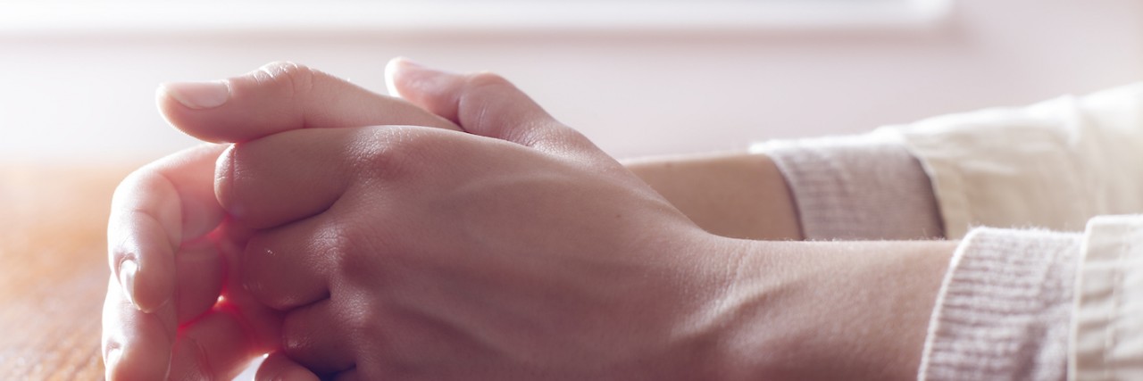 What It's Like to Be a Special Needs Mom With Anxiety Close-up of a woman's hands on a wooden table