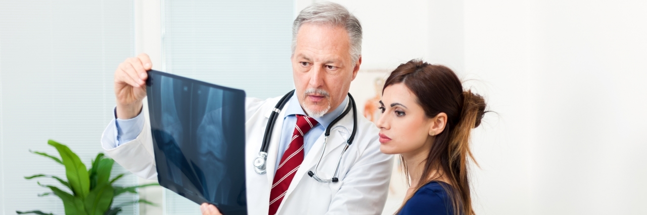 To the Newly Diagnosed With Osteonecrosis Doctor showing a radiography to his patient