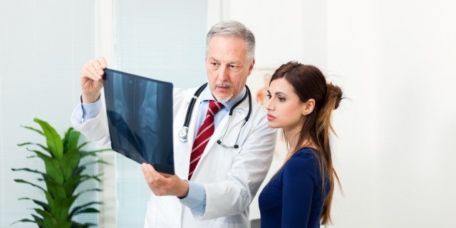 To the Newly Diagnosed With Osteonecrosis Doctor showing a radiography to his patient