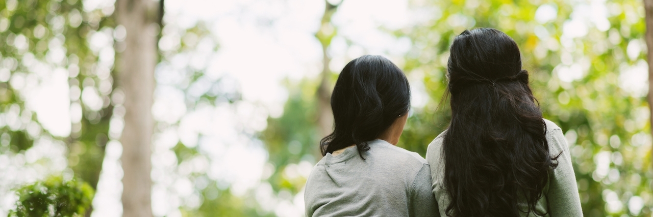 What I Should Tell My Friends About My Depression Two female friends sitting in a park