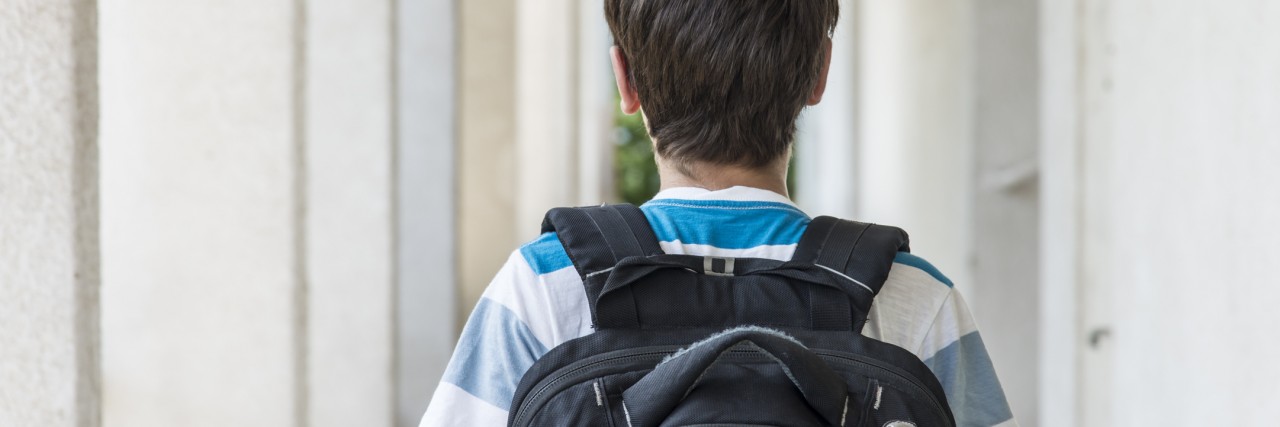 Finding Positives and Blessings in My Son's Tourette Syndrome Teenage school boy with a backpack walking to school