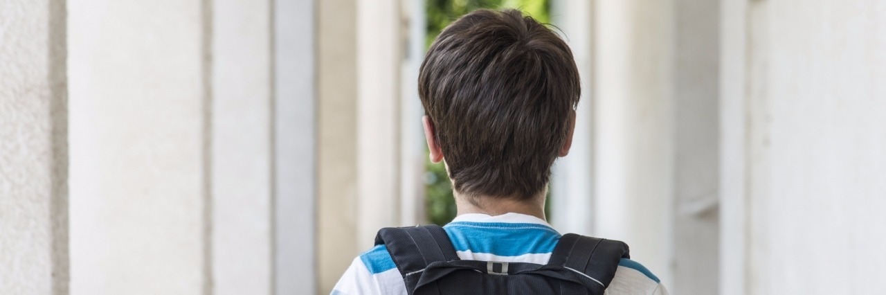 Child With Autism Adjusts to a New School After a Move school boy with a backpack