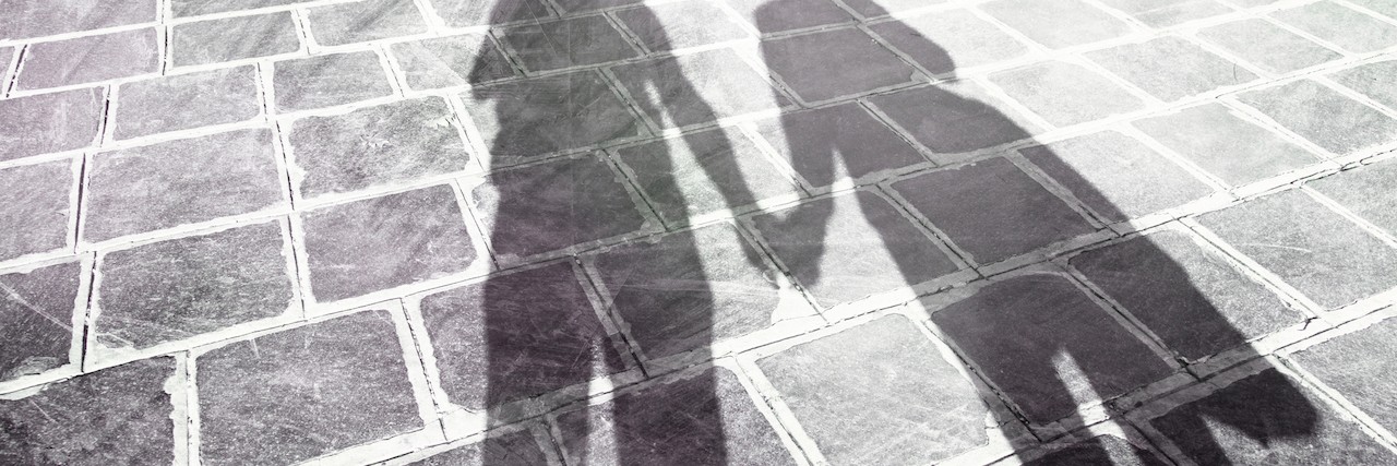 Dealing With People Who Force People With Disabilities to Accept Help shadows of two people holding hands