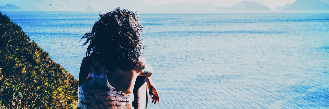 Minority Mental Health: Depression and Anxiety Don't Discriminate Woman sitting on the edge of the cliffs