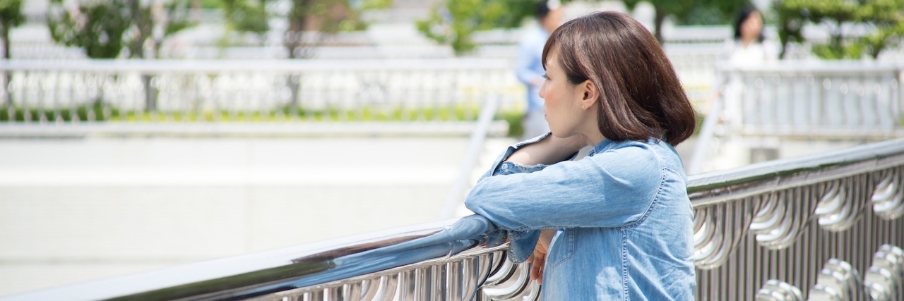 What People Don't See About My Fibromyalgia on the Good Days woman overlooking bridge