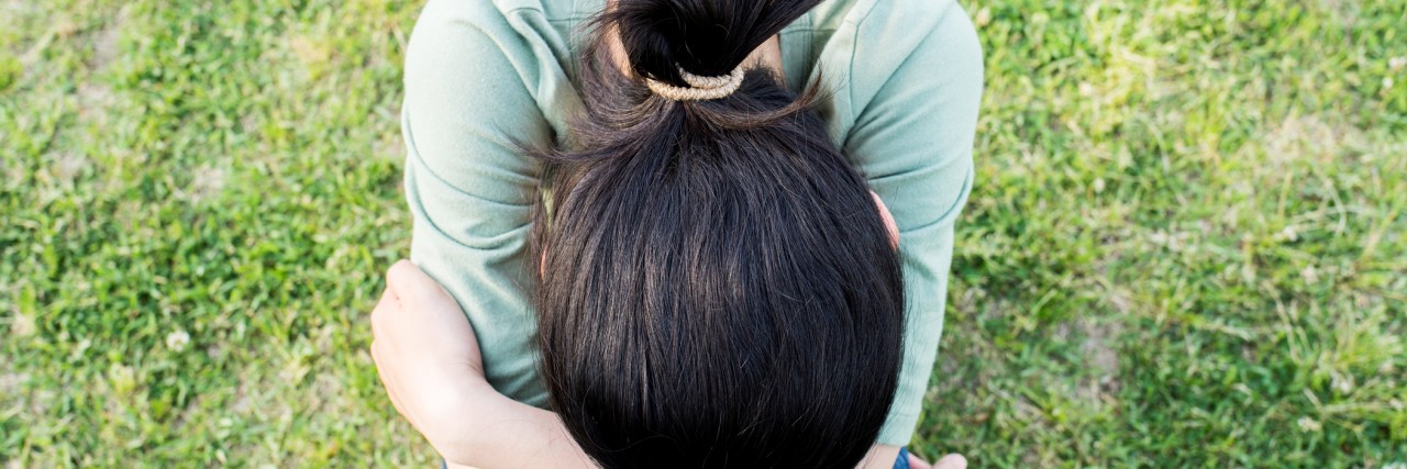 woman slouched over