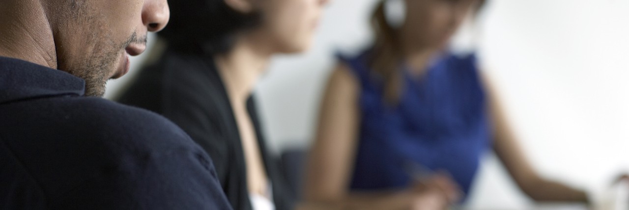 Telling Co-Workers About Mental Illness and Addiction Problems office meeting