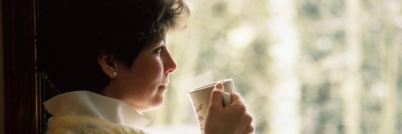 When Chronic Illness Makes Me Question Myself as a Parent woman looking thoughtfully out a window