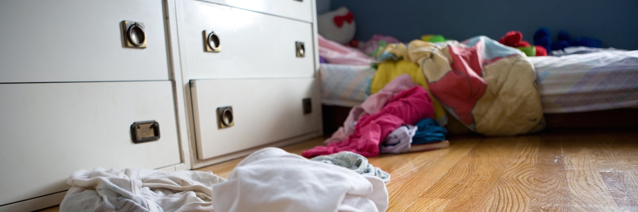Subtle Ways Depression Affects Your Daily Life Child's bedroom with dirty laundry on floor