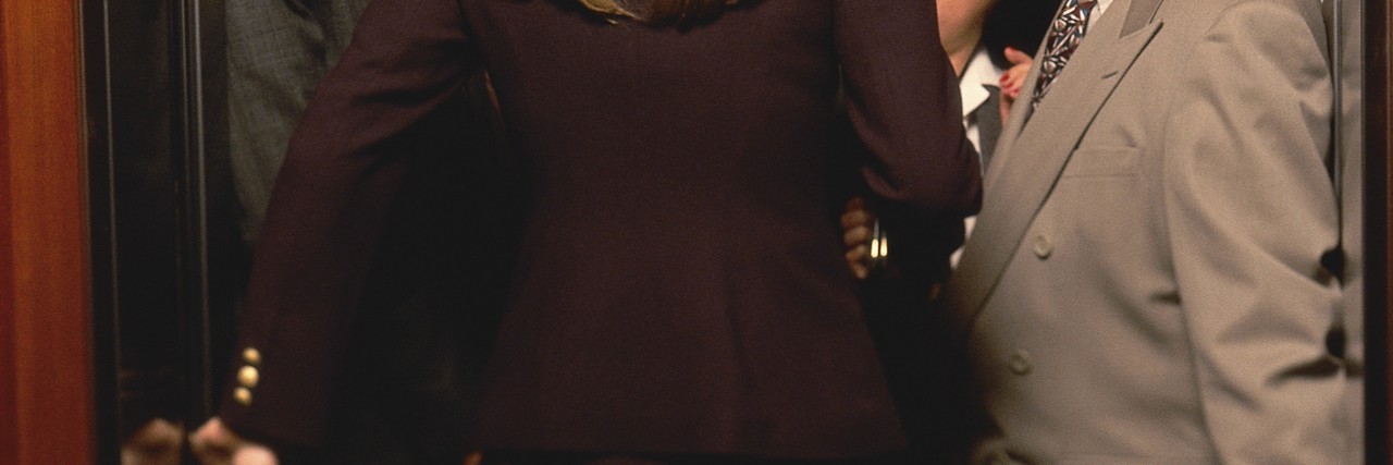 How NYC Elevators Helped Me Prepare for My MRI Woman Entering Crowded Elevator