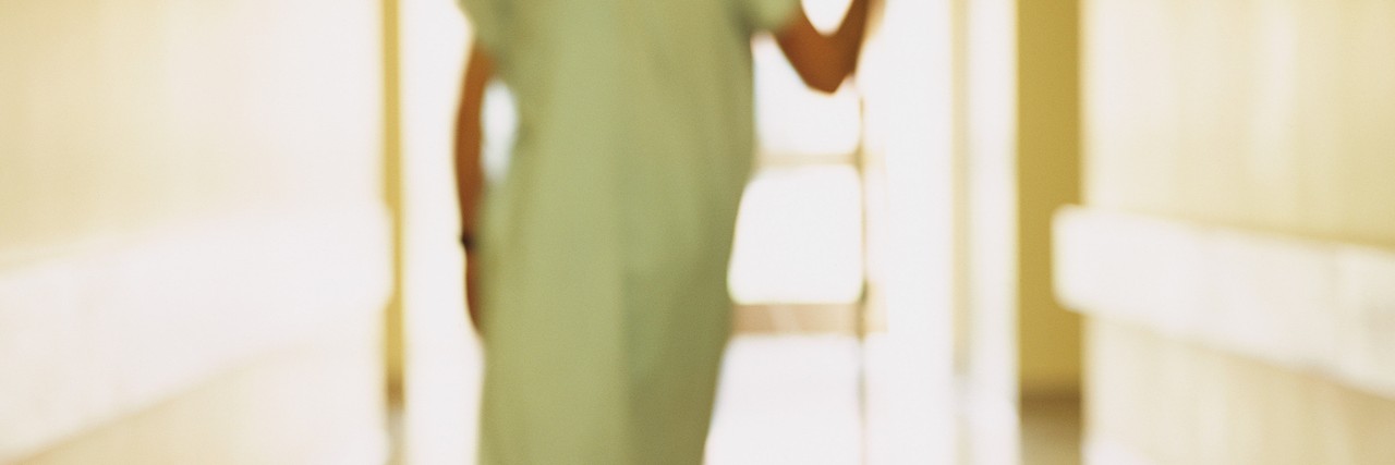 Raising Awareness for Pulmonary Hypertension: What to Consider Person walking in hallway with IV stand, blurred shot