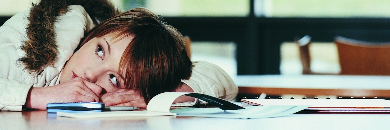 Worried Female sitting at a desk