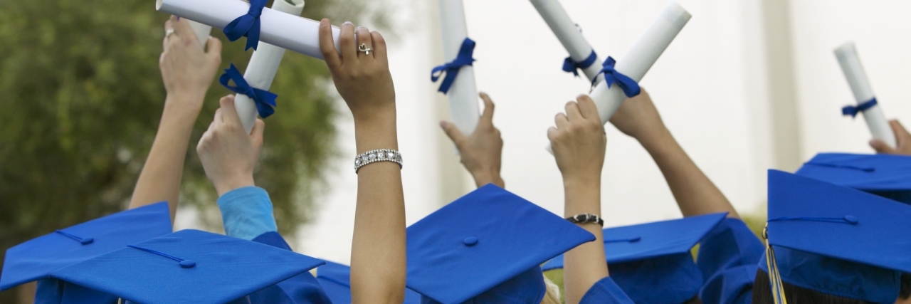 To the High School Graduate With Depression: You Have the Power graduates holding diplomas in the air