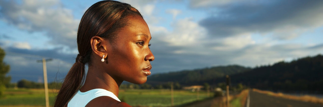 Lessons I Learned From Endometriosis woman standing by road turning to the side