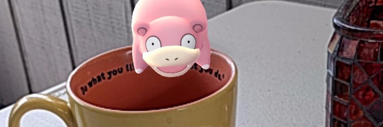 pokemon sitting on a coffee cup