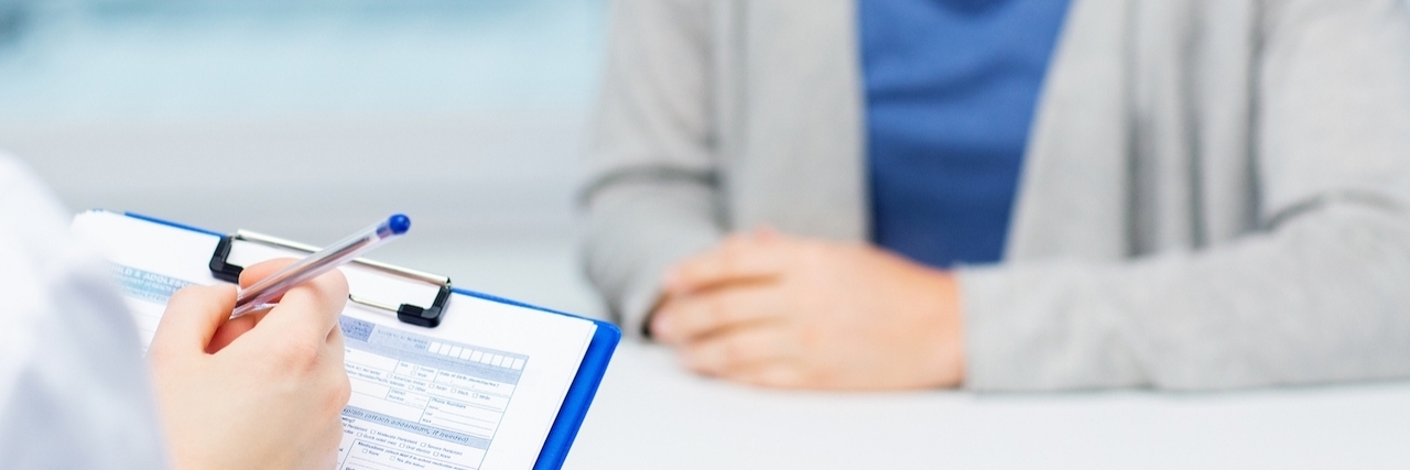 How to Advocate for Your Health Treatment medicine, health care and people concept - close up of doctor with clipboard and young woman patient meeting at hospital