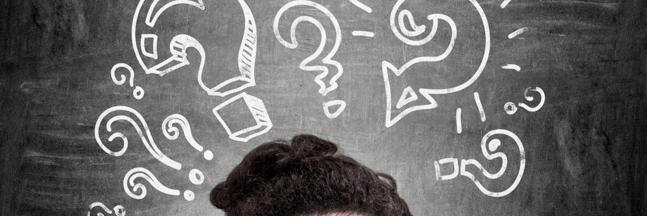 Types of Brain Fog From Chronic Fatigue Syndrome Confused woman thinking about answers to her questions on chalkboard background