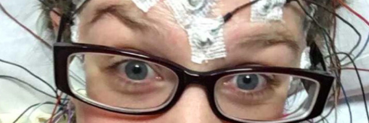 What I Wasn't Prepared for When I Started Having Seizures Contributor, a white woman with glasses, with undergoing tests with wires attached to her forehead