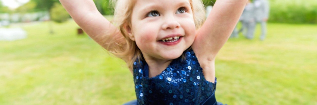 How to Help Parents of Kids With Severe Congenital Heart Defects The author's daughter playing on the grass