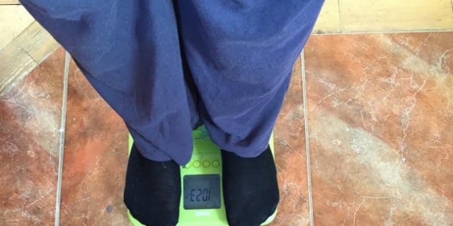 woman's feet standing on scale