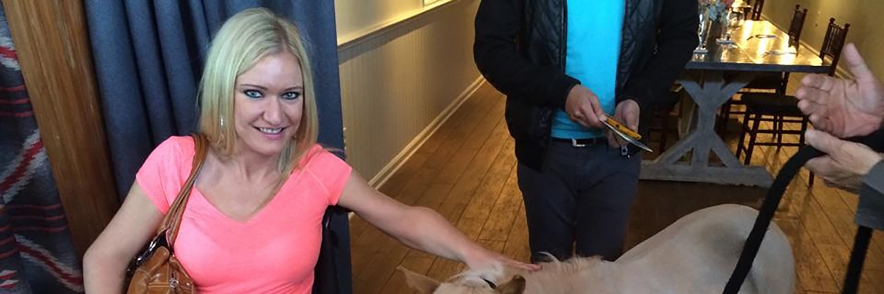 I Stopped Trying to Hide My Wheelchair in Photos Renee with a miniature horse.