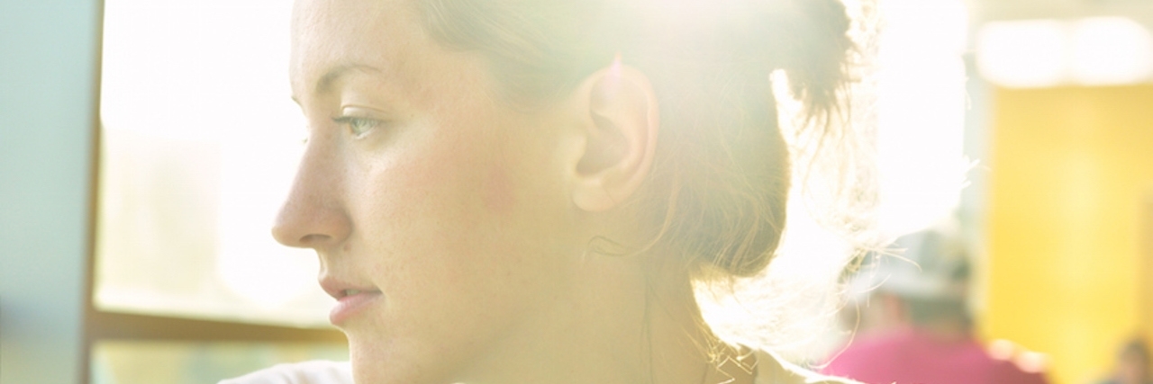 Answering 'How Are You?' With 'I'm Tired' Woman in cafe looking sideways