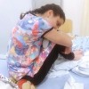 girl sitting on hospital bed
