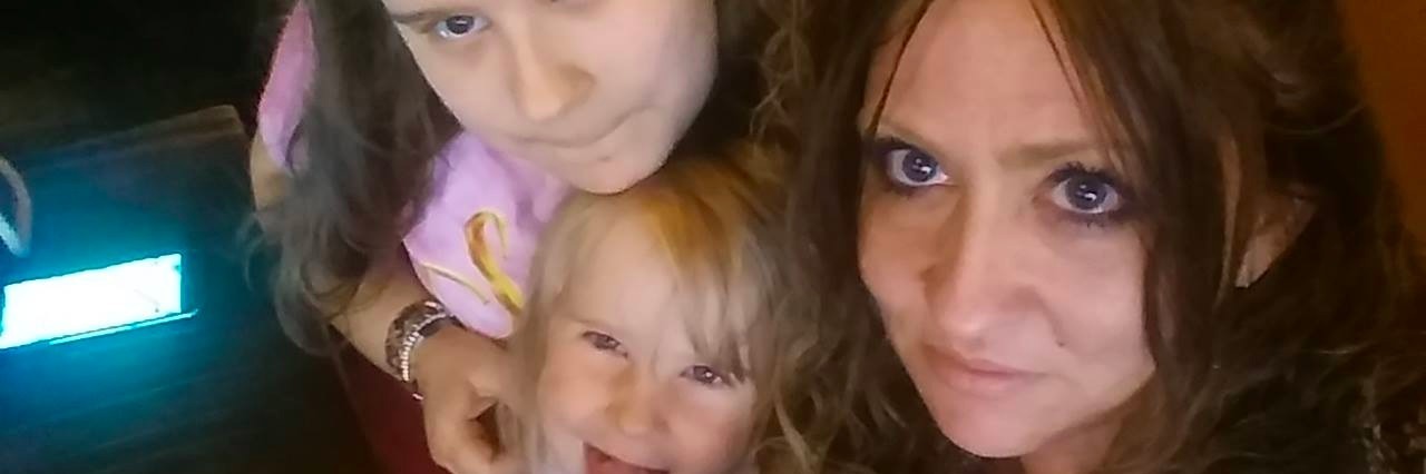 Advice for Parents Caring for Chronically Ill Kids mom with her two daughters