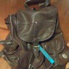 a brown leather backpack