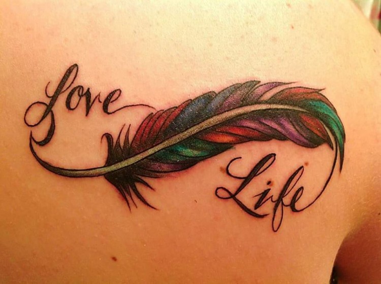 tattoo of a feather reads" love life"