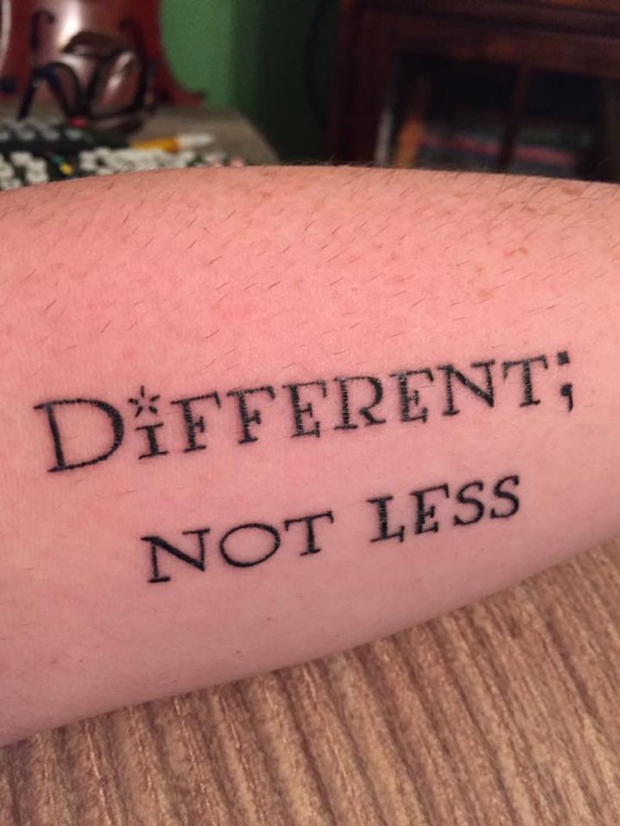 tattoo reads: different, not less