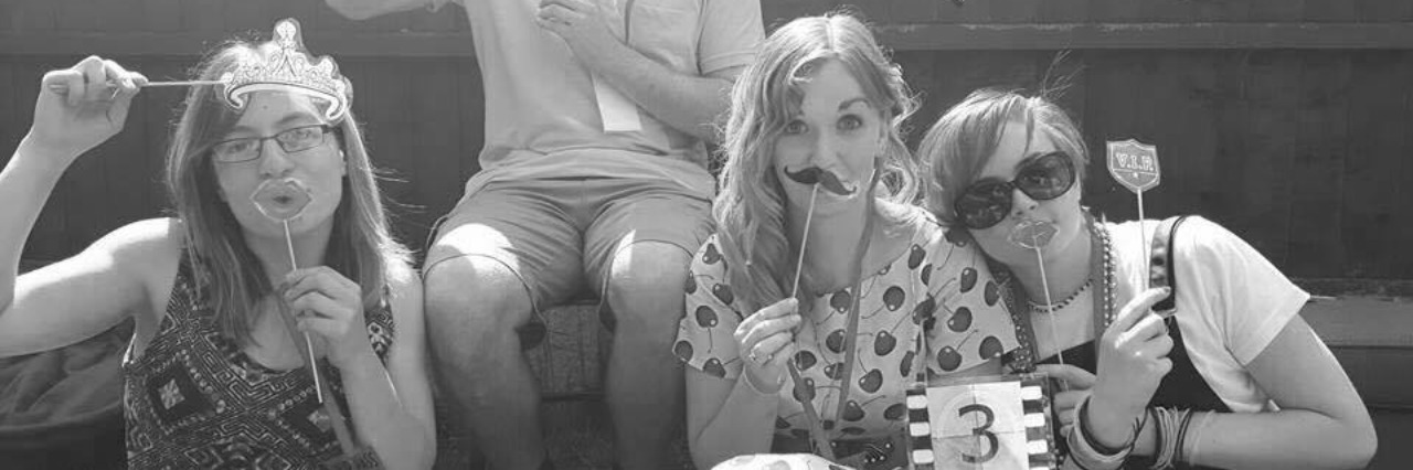 Letter to People Who Know Someone With Hypothyroidism group of friends with props sitting on floor