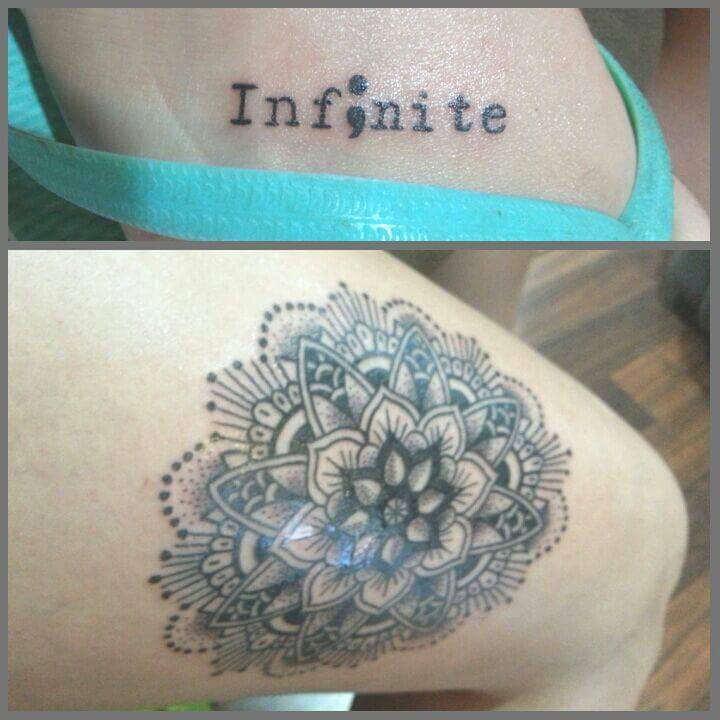 First tattoo (on her root) reads infinite. Second tattoo (on her leg) is a mandala
