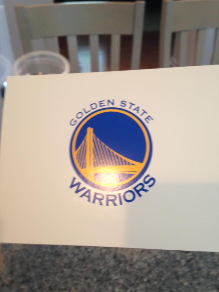 White card with Golden State Warriors logo (a yellow bridge over a blue background) on it