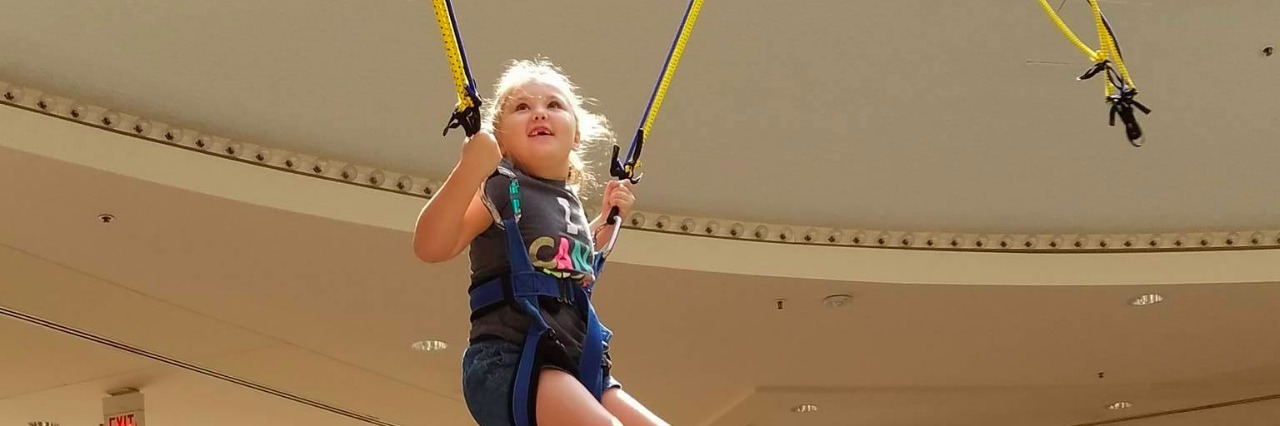 little girl bungee jumping