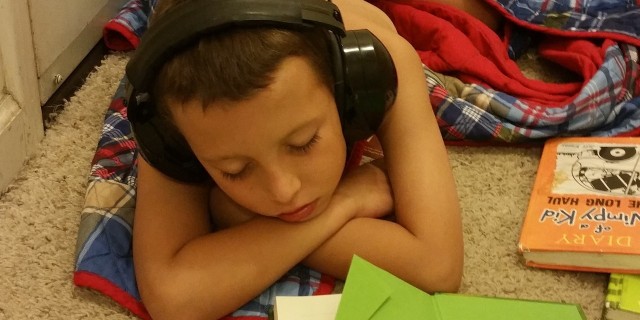 On Acceptance and Unconditional Love of Autistic Children little boy doing his homework