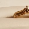 gold engagement ring with diamond in center