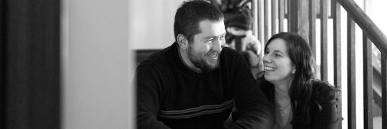 Husband's Advice for Coping With a Sick Child husband and wife sitting on stairs