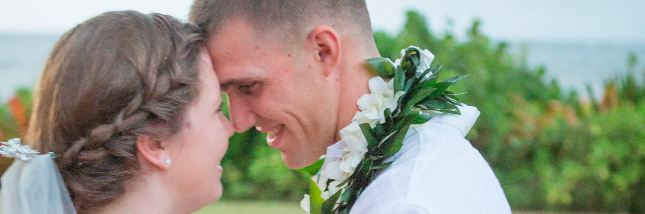 To the Man Who Has Loved Me Through My PTSD and Bipolar Disorder A couple on their wedding day, embracing eye to eye.