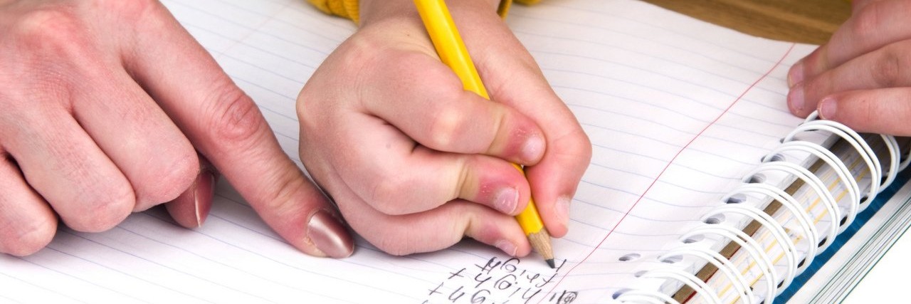 mother helps son with homework